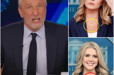 Karoline Leavitt Was So Humiliated by Jon Stewart, She Gave Up Her Cross Necklace. In a jaw-dropping moment that stunned viewers, Karoline Leavitt was left visibly shaken after a heated exchange with Jon Stewart on live television. Insiders say Stewart’s relentless questioning struck so deeply that Leavitt, known for proudly wearing her cross necklace, quietly removed it backstage—sparking a wave of speculation about what really happened behind the scenes. Was this the breaking point for Leavitt, and what did Stewart say that cut so deep? Here’s the inside story on the confrontation that’s got social media buzzing.