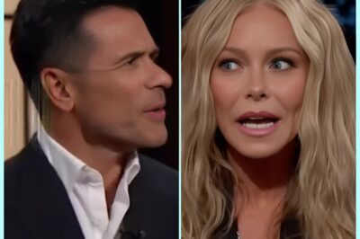 AWKWARD ON-AIR MOMENT: Kelly Ripa Jokes She Needs Space from Mark Consuelos After He Admits to Tuning Her Out! Things got uncomfortably real on live TV when Kelly Ripa quipped about needing to sit farther away from her husband and co-host, Mark Consuelos, after he casually confessed he wasn’t really listening to her during the show. The unexpected admission left the audience—and viewers at home—buzzing. Is this just playful banter between TV’s favorite couple, or is there more to the story? As fans speculate about the couple’s chemistry both on and off the screen, one thing’s for sure: mornings on Live just got a whole lot more interesting. Stay tuned to see how this on-air tension unfolds!